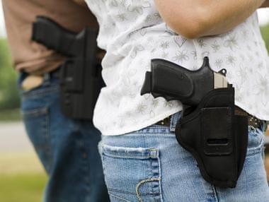 two people with guns