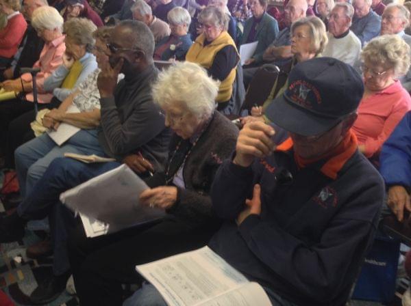 Retirees review their Medicare Advantage options during a forum on Friday, Nov. 15, 2013 in Champaign, Ill.