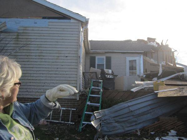Mary Sutherlin looks at what's left of her home Tuesday, November 19 in Gifford.
