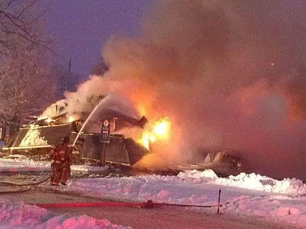 Firefighters work to put out the blaze on Dec. 17, 2013.