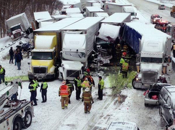 Emergency crews work at the scene of a massive pileup Thursday involving more than 40 vehicles, many of them semitrailers, along Interstate 94.