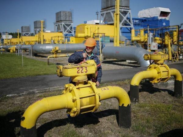 A worker turns a valve at an underground gas storage facility near Striy on Wednesday. Russia has said state-controlled exporter Gazprom will supply China with natural gas via a Siberian pipeline beginning in 2018.