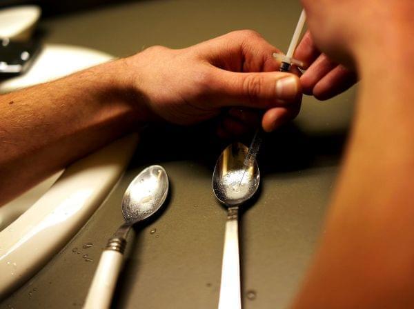A heroin user in St. Johnsbury, Vt., prepares to shoot up.