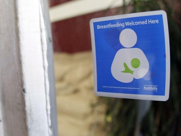 A decal reading "Breastfeeding Welcomed Here" is displayed on the door to a store on Thursday, Aug. 11, 2011, in Nashville, Tenn. Nashville's Metro Health Department is encouraging local businesses to make breastfeeding mothers feel we