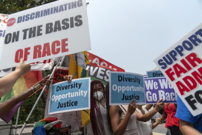 People protest outside of the Supreme Court in Washington, Thursday, June 29, 2023. The Supreme Court on Thursday struck down affirmative action in college admissions, declaring race cannot be a factor and forcing institutions of higher education to look for new ways to achieve diverse student bodies 