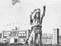 old photo of Chief Illiniwek at football game